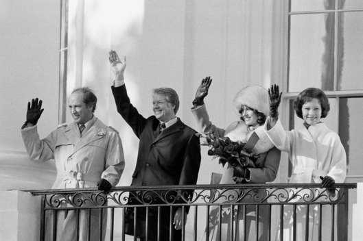 Pres. Jimmy Carter second from left and First Lady Rosalynn Carter right wave from a White House balcony along with Canadian Prime Minister Pierre Elliott Trudeau left and Mrs. Margaret Trudeau Monday Feb. 21 1977 Washington D.C. The Canadian