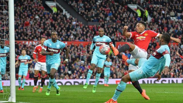 Martial late show keeps Manchester United in FA Cup