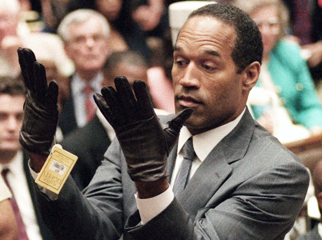 VINCE BUCCI  THE ASSOCIATED PRESS FILESO.J. Simpson holds up his hands before the jury after putting on gloves similar to the infamous bloody gloves during his double-murder trial in 1995