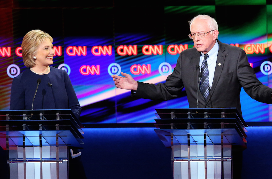 Democratic presidential candidate Senator Bernie Sanders D-Vt and Democratic presidential candidate Hillary Clinton speaking during the CNN Democratic Presidential Primary Debate at the Whiting Auditorium at the Cultural Center Campus in Flint Michigan