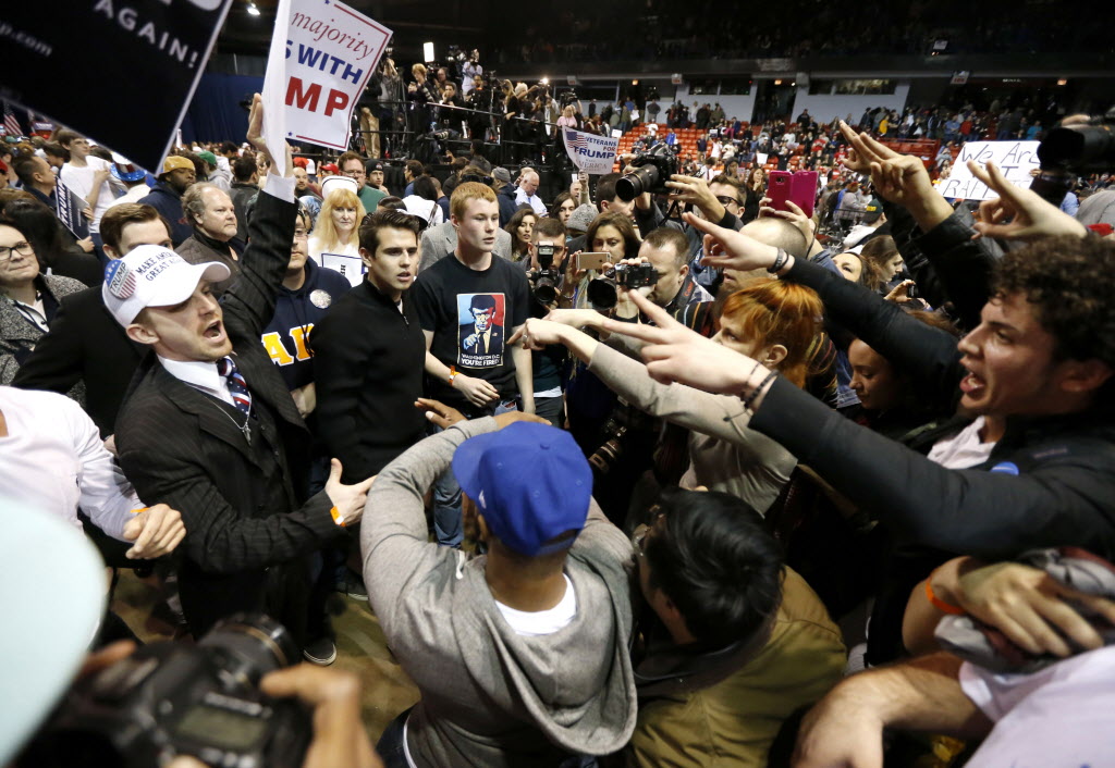 Supporters of Republican presidential candidate Donald Trump face off with protesters after a rally on the campus of the University of Illinois Chicago was canceled due to security concerns Friday