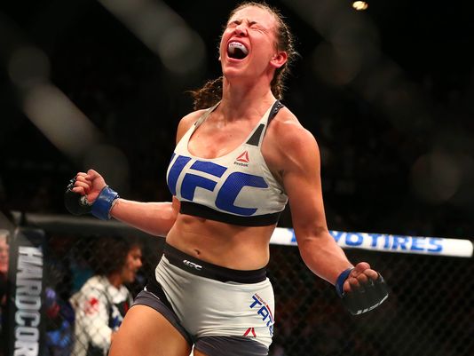 Miesha Tate celebrates her victory by submission against Holly Holm during UFC 196 at MGM Grand Garden Arena