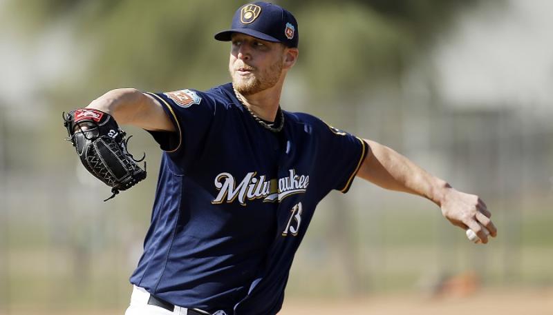 Milwaukee Brewers Will Smith throws during a spring training baseball workout Tuesday