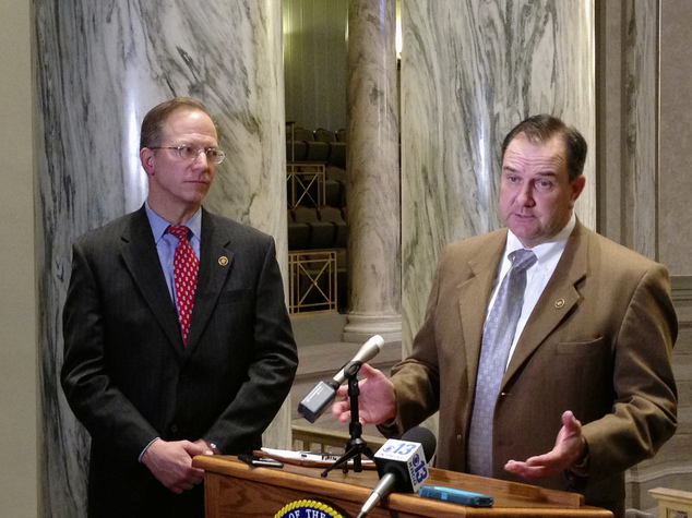 Missouri Senate Majority Leader Mike Kehoe talks with reporters as Republican Sen. Bob Onder looks on Wednesday