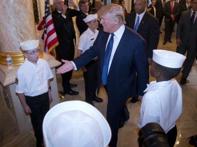 Republican presidential candidate Donald Trump center is greeted by Attorney General of Florida Pam Bondi left as he arrives at the Palm Beach County GOP Lincoln Day Dinner at the Mar-A-Lago Club Sunday