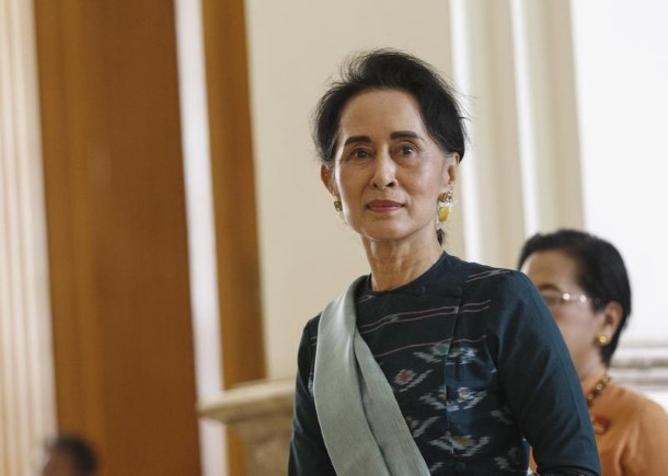 National League for Democracy leader Aung San Suu Kyi arrives at the Union Parliament in Naypyidaw