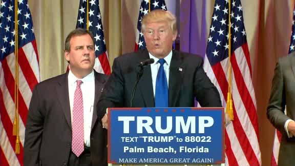 Dead-Eyed Chris Christie Behind Donald Trump Is All Of Us