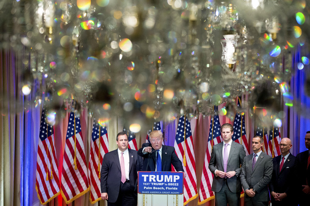 Republican presidential candidate Donald Trump accompanied by New Jersey Gov. Chris Christie left and his son Eric Trump third from left takes question