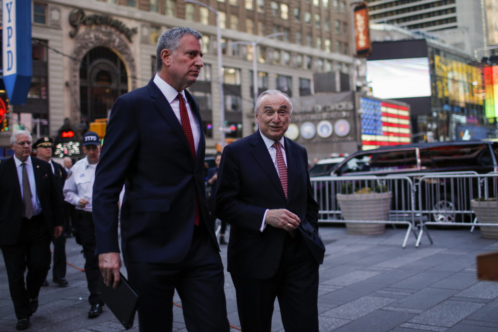 New York Mayor Bill de Blasio and New York Police Commissioner William Bratton arrive at Times Square for a press conference in New York