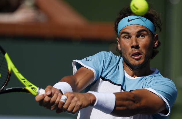 Rafael Nadal of Spain returns to Fernando Verdasco of Spain during the BNP Paribas Open tennis tournament Tuesday