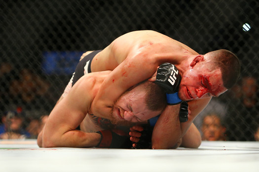 Nate Diaz gets the rear-naked choke in so deep that Conor Mc Gregor quits