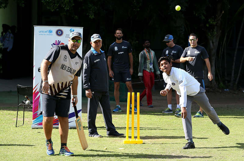 New Zealand cricketers play match with local children during a practice session in Mohali on Monday