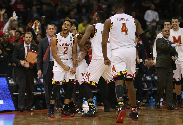 SPOKANE WA- MARCH 20 Melo Trimble #2 of the Maryland Terrapins celebrates with teammtes in the second half against the Hawaii Warriors during the second round of the 2016 NCAA Men's Basketball Tournament at Spokane Veterans Memorial Arena on Marc