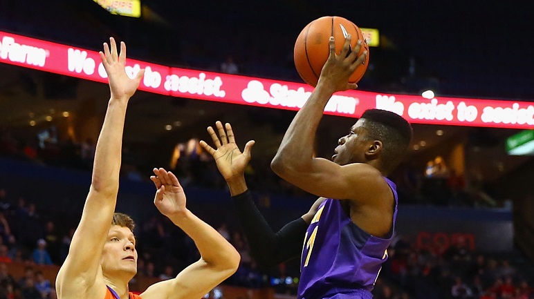 Wes Washpun #11 of the Northern Iowa Panthers shoots the ball against Egidijus Mockevicius #55 of the Evansville Aces during the MVC Basketball Tournament final game at the Scottrade Center