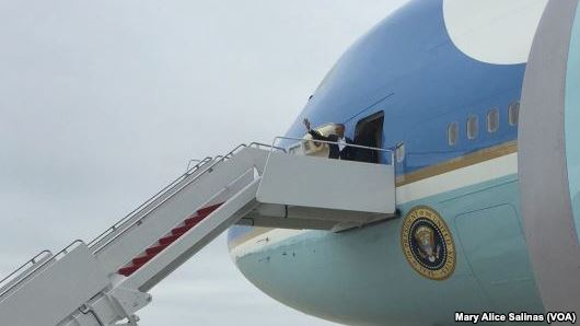 FILE- U.S. President Barack Obama waves from the door of Air Force One as he prepares to depart for Havana Cuba at Andrews Air Force Base Md