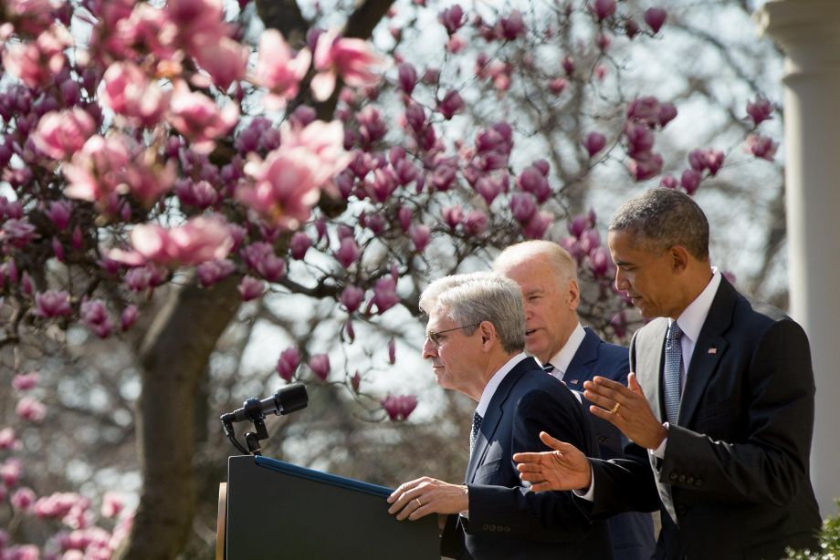 Federal appeals court judge Merrick Garland left accompanied by President Barack Obama and Vice President Joe Biden steps to the microphone as he is introduced as Obamas nominee for the Supreme Court during an announcement in the Rose Garden of the W