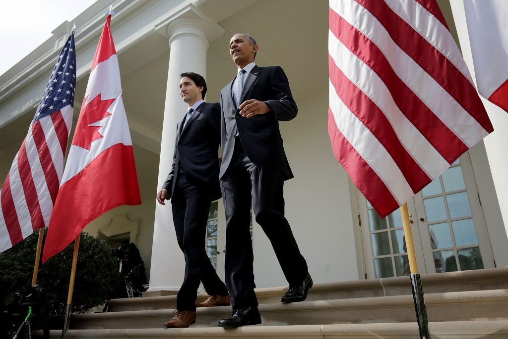 U.S. President Barack Obama and Canadian Prime Minister Justin Trudeau walk from the Oval Office to a joint press conference in the Rose Garden of the White House