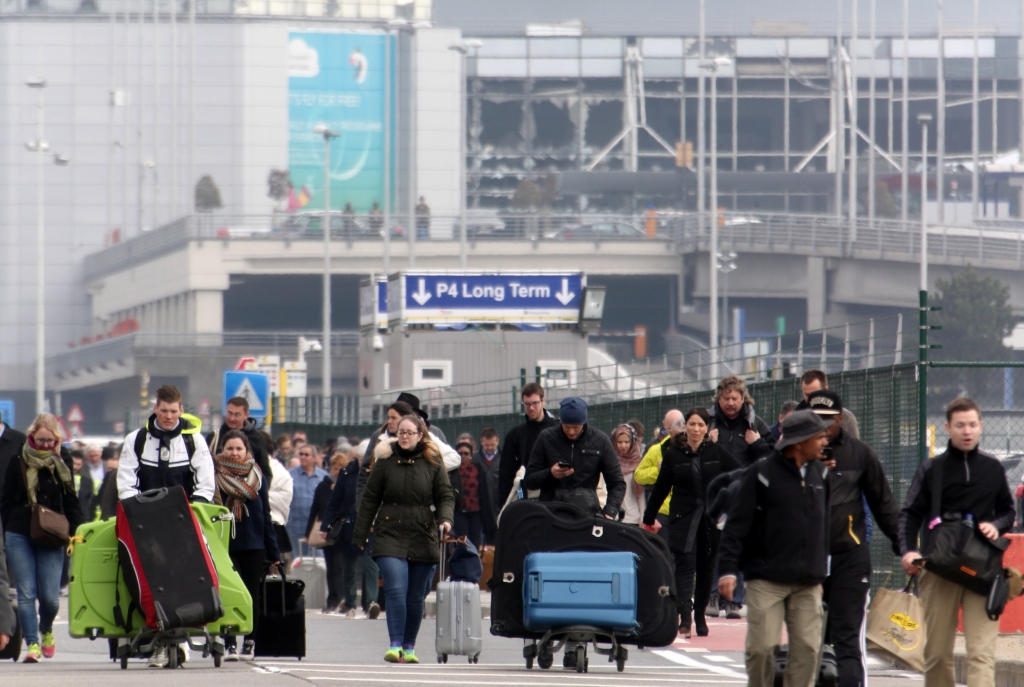 BRUSSELS BELGIUM- MARCH 22 Passengers are evacuated from Zaventem Bruxelles International Airport after a terrorist attack