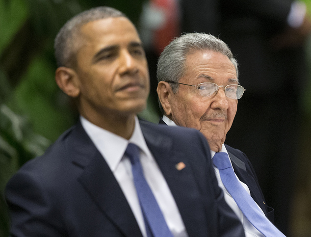 U.S. President Barack Obama left attends a State Dinner hosted by Cuban President Raul Castro right at the Palace of the Revolution Monday