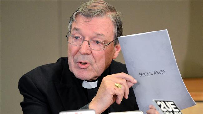 13 2012 shows Australia’s Cardinal George Pell holding the response report of the Catholic archdiocese on sexual abuse during a press conference in Sydney Australia