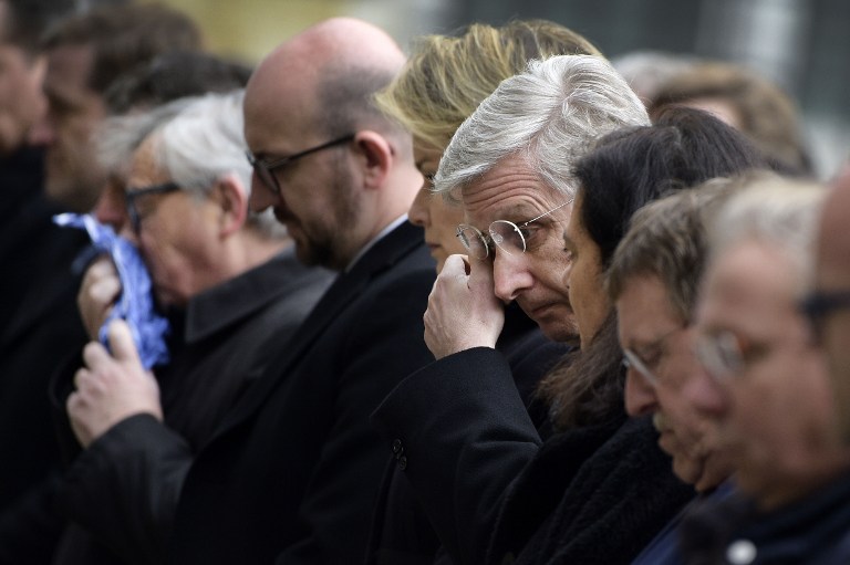 European Commission President Jean Claude Juncker Belgian Prime Minister Charles Michel and King Philippe of Belgium react before observing a minute of silence