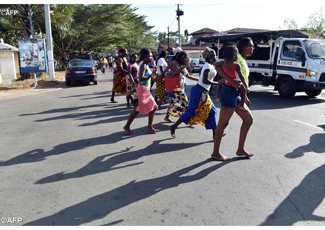 People flee after gunmen opened fire on 13 March 2016 at guests at a popular beach resort in Grand Bassam- AFP