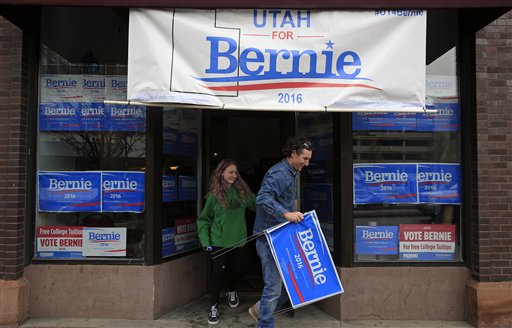 People walk out of a Bernie Sanders campaign office on the day of the Utah Caucus Tuesday