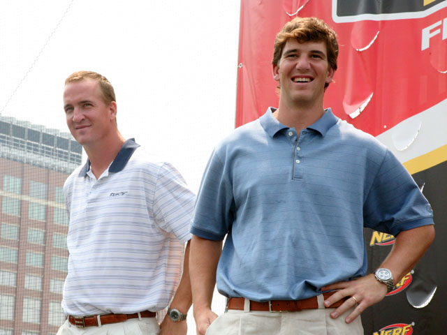 Indianapolis Colts quarterback Peyton Manning and New York Giants quarterback Eli Manning attends the NERF Father's Day Football Throwdown