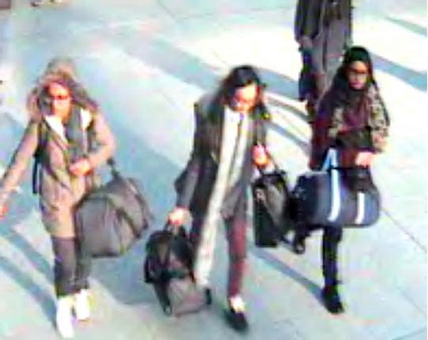 CORRECTING DATE TO MONDAY FEB. 23- This is a still taken from CCTV issued by the Metropolitan Police in London on Monday Feb. 23 2015 of 15-year-old Amira Abase left Kadiza Sultana,16 centre and Shamima Begum 15 going through Gatwick airport