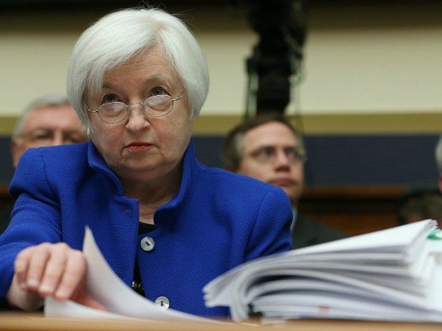 Federal Reserve Board Chairwoman Janet Yellen looks over her papers during a House Financial Services Committee hearing on Capitol Hill