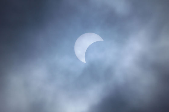 A partial solar eclipse is seen from Rizal Park in Manila. The eclipse was seen in other Asian countries such as Cambodia Myanmar Vietnam Thailand and Indonesia. A solar eclipse occurs when the moon gets between Earth and the sun and the moon casts