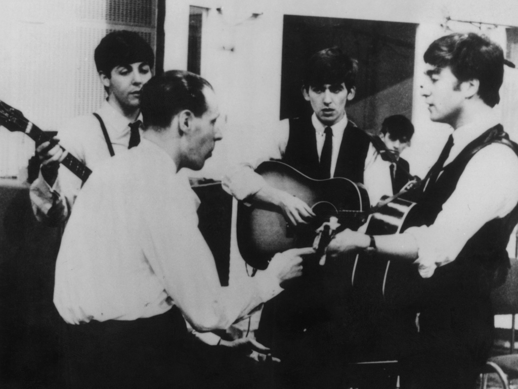 Producer George Martin in a recording session with The Beatles