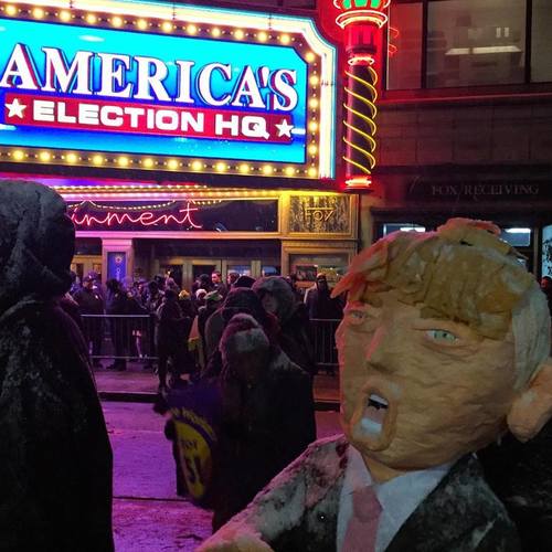 Protesters hoist a Trump dummy outside Detroit #GOPdebate