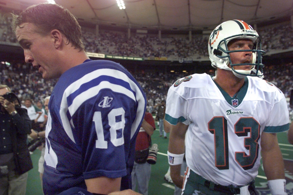 Peyton Manning dejectedly walks off after greeting Dan Marino his'favorite player after his father after the Dolphins defeated the Colts 24-15 in 1998 in Manning's NFL debut