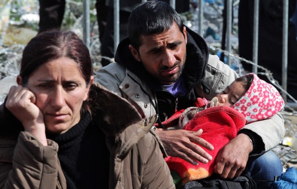 Refugees wait for permission to cross the Greek border at a camp in Idomeni northern Greece