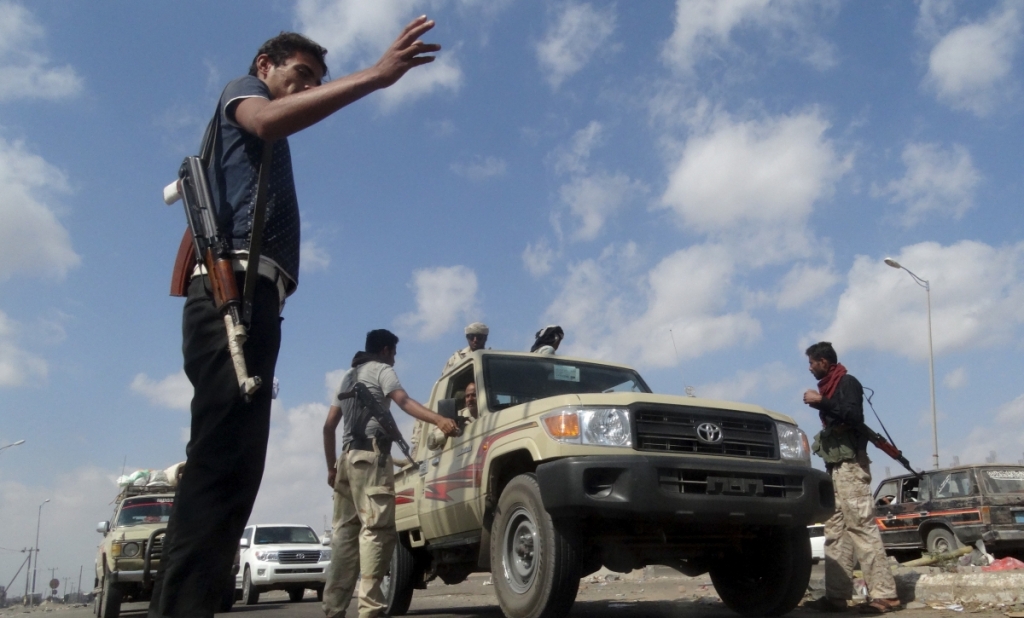 ReutersMembers of the pro-government Popular Committees militia man a checkpoint at an entrance of Yemen's southern port city of Aden