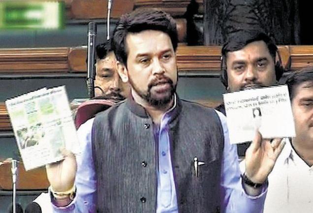 BJP MP Anurag Thakur holds aloft articles of Arun Jaitley from 2013
and 2014 in the Lok Sabha in New Delhi on Friday