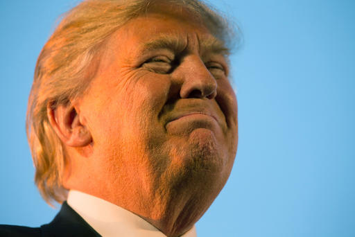 Republican presidential candidate Donald Trump pauses during while speaking at a rally at Millington Regional Airport in Millington Tenn. Feb. 27 2016