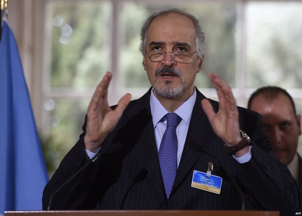 Syrian Ambassador to the United Nations and head of the government delegation to the peace talks Bashar al Jaafari gestures as he speaks during a press conference in Geneva on March 16