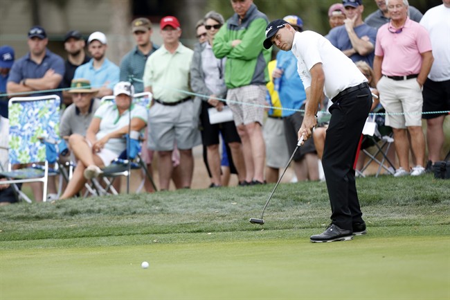 Bill Haas putts on the first hole during the final round of the Valspar Championship golf tournament Sunday