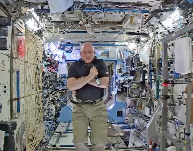 In this image from video made available by NASA astronaut Scott Kelly speaks to reporters on Earth during a news conference held on the International Space Station on Thursday