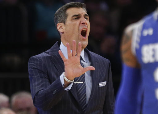 Villanova head coach Jay Wright calls out to his team during the first half of an NCAA college basketball game against Seton Hall during the Big East men's tournament Saturday