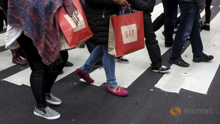 Shoppers cross 34th Street the day after Christmas in the Manhattan borough of New York