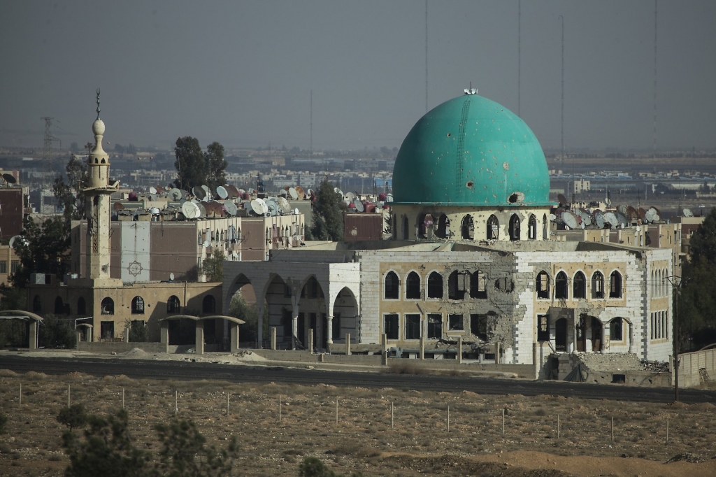 Shrapnel pot-marks are seen in a mosque at northern outskirts of Damascus Syria Thursday