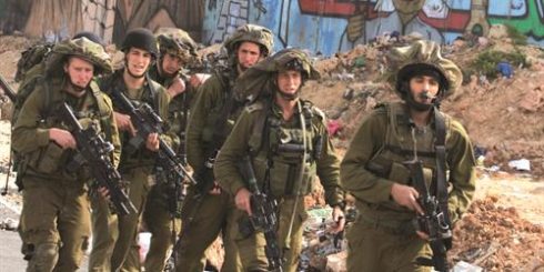 Soldiers patrol the separation barrier between Ramallah and Jerusalem