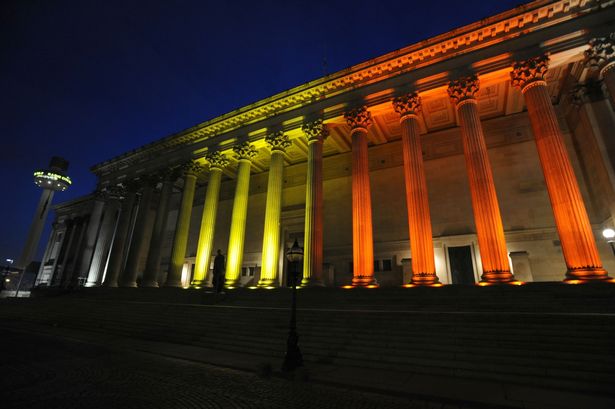 St George's Hall Liverpool lit up in the colours of the national flag of Belgium in tribute to the victims of the terror attacks in Brussels