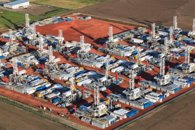 Stacked rigs are seen along with other idled oil drilling equipment at a depot in Dickinson North Dakota