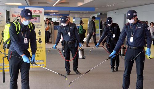 Staff sterilize facilities at Incheon International Airport on Tuesday. /Newsis