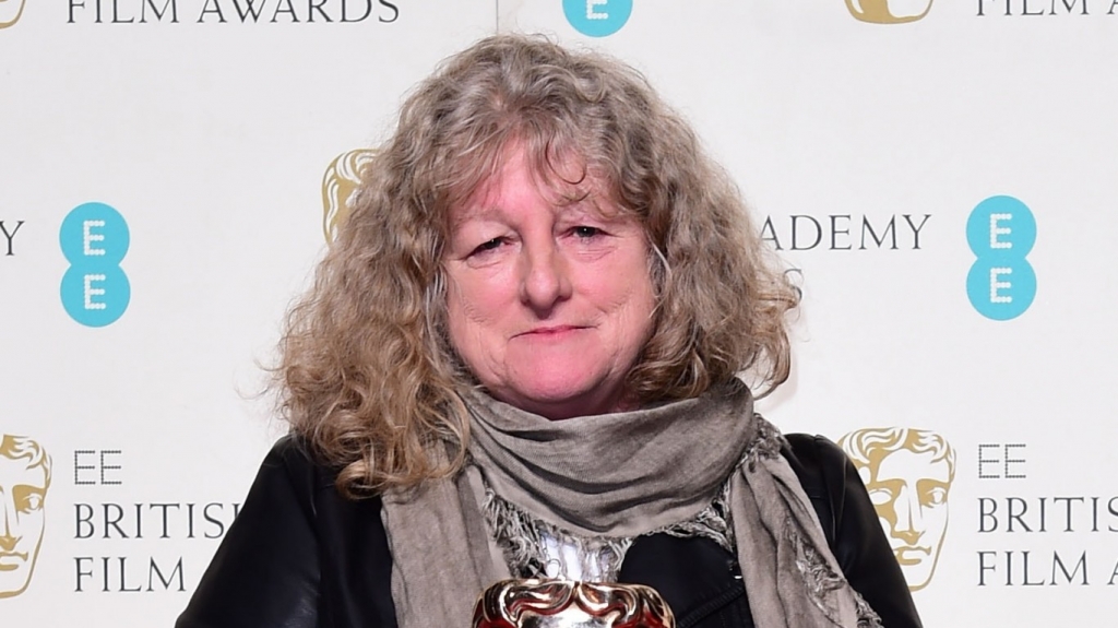 Stephen Fry's'bag lady Jenny Beavan kept it casual as she picked up her Oscar