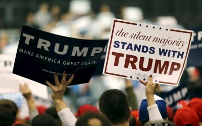 Supporters hold up campaign signs before a speech by Republican presidential candidate Donald Trump in Cleveland